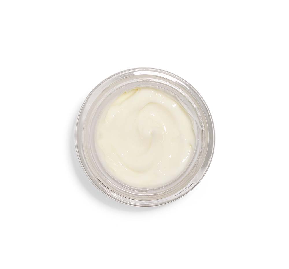 Top view of an opened jar of FarmHouse Fresh Mighty Brighty Vitamin C Brightening face moisturizer with squalene and retinol.