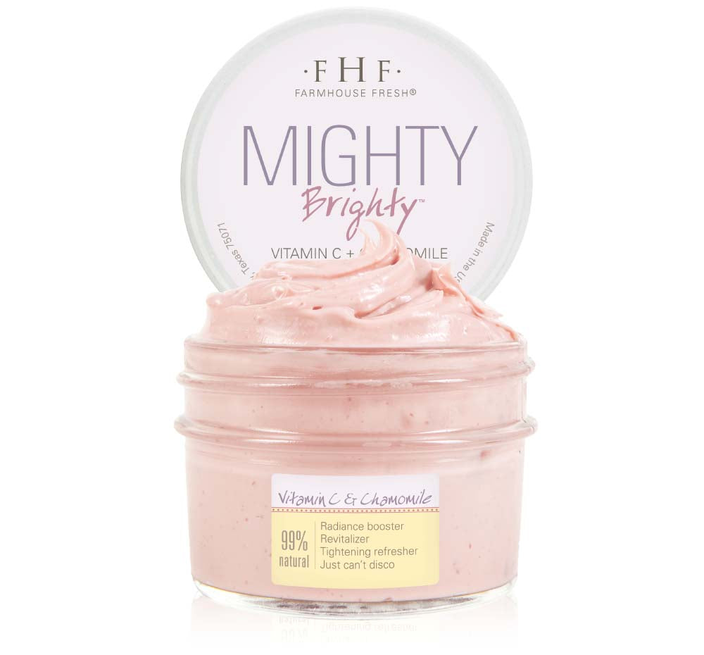 A jar of FarmHouse Fresh Mighty Brighty Vitamin C + Chamomile Brightening Face Mask that brings a smooth, soft and silky complexion with a brighter, more radiant look.