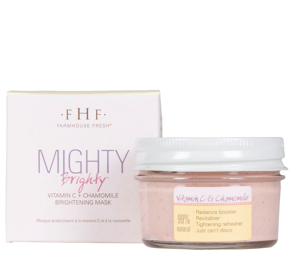 A jar and a box of FarmHouse Fresh Mighty Brighty Vitamin C + Chamomile Brightening Mask made with organic oranges, retinol, brightening clays, fermented lemon peel extract, and antioxidant-full extracts.