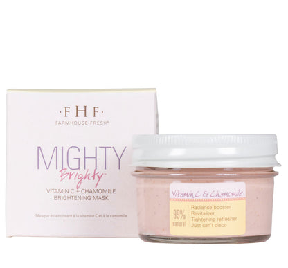 A jar and a box of FarmHouse Fresh Mighty Brighty Vitamin C + Chamomile Brightening Mask made with organic oranges, retinol, brightening clays, fermented lemon peel extract, and antioxidant-full extracts.