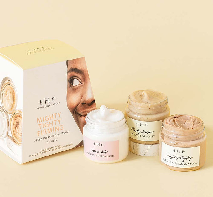 Three jars from Mighty Tighty Firming 3-step Instant Spa Facial by FarmHouse Fresh next to a box. The set includes a face moisturizer, face exfoliator and a tightening face mask.