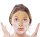 A woman is wearing Mighty Tighty Turmeric & Banana Tightening Mask by FarmHouse Fresh on her face’s T-zone to help reduce the look of wrinkles and fine lines.