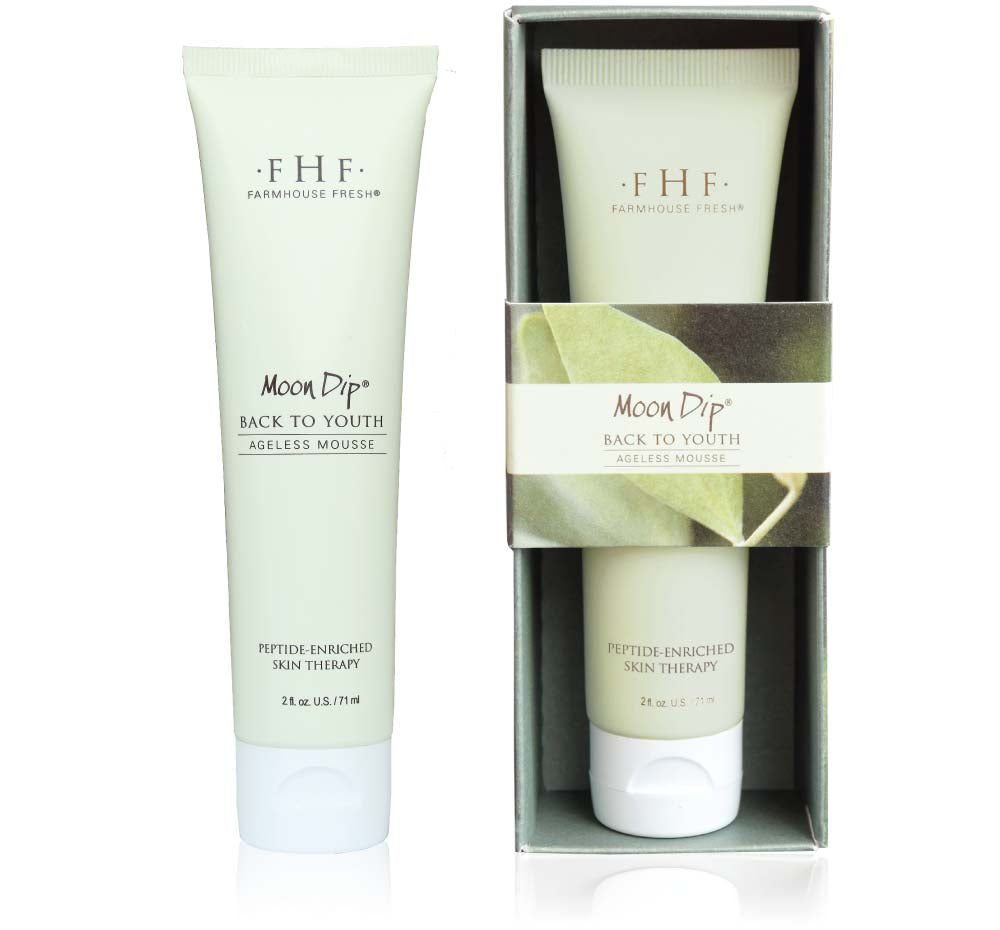 A box and a tube of FarmHouse Fresh Moon Dip anti-aging lotion for Hands that moisturizes hands and has a beautiful scent in the vanilla family.