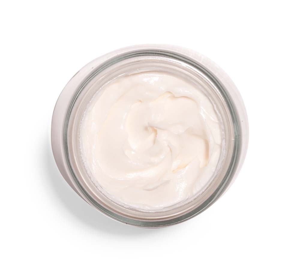 Top view of an opened jar of lightweight body cream from FarmHouse Fresh called Serene Moon Dip, scented with unisex fragrance of greens, wintermint, apple and amber.