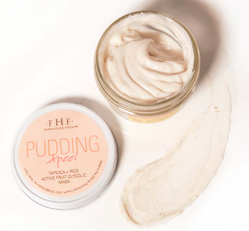 A jar and a texture smudge of FarmHouse Fresh Pudding Apeel Face Mask made with hydrating honey and coconut milk.