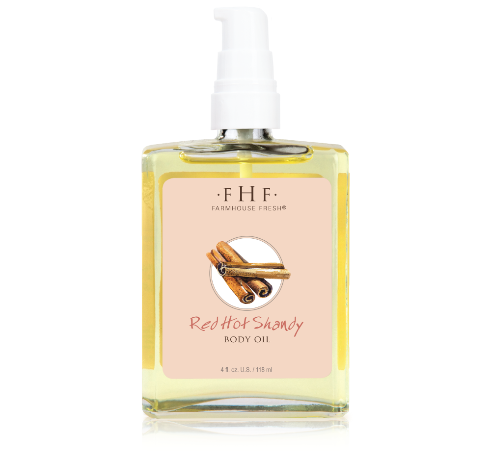 A bottle of Farmhouse Fresh Red Hot Shandy Body Oil, perfect for those seeking skincare products with fall and holiday scents.