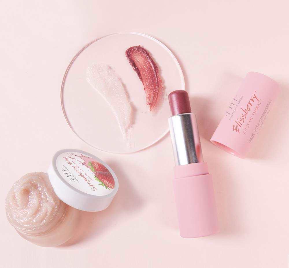 FarmHouse Fresh Strawberry Wine lip polish and Blissberry Lip Therapy balm next to their texture swatches.