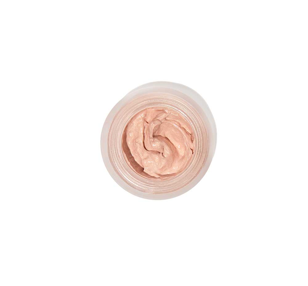 Top view of an opened jar of FarmHouse Fresh Stunning Dawn Brightening Eye Cream that visibly brightens the under eye area.