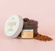 A jar of FarmHouse Fresh Sundae Best Softening Mask with CoQ10 on top of chocolate which is one of the main ingredients in this skincare product for aging skin.