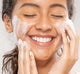 A woman is washing her face with FarmHouse Fresh C the Future Foam Facial Cleanser to refresh and clarify skin.