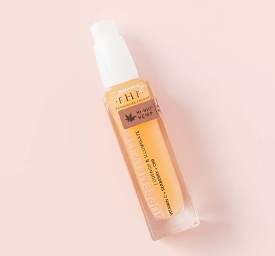 A bottle of FarmHouse Fresh Supremely Lit Serum-in-Oil with CBD for radiant, healthy looking skin.