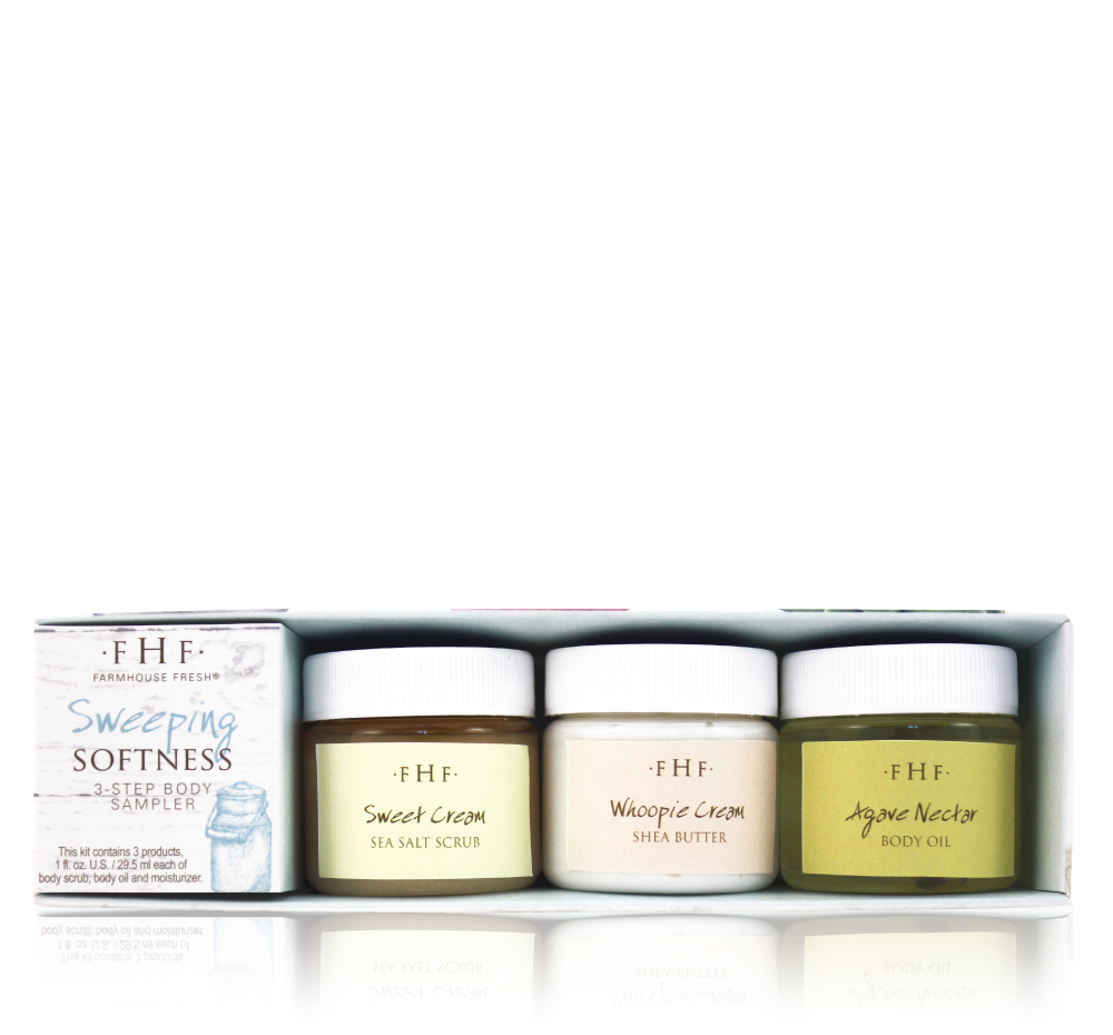 A box of Sweeping Softness 3-Step Body Sampler by FarmHouse Fresh. The sampler contains a body scrub, moisturizing shea butter cream and a body oil.