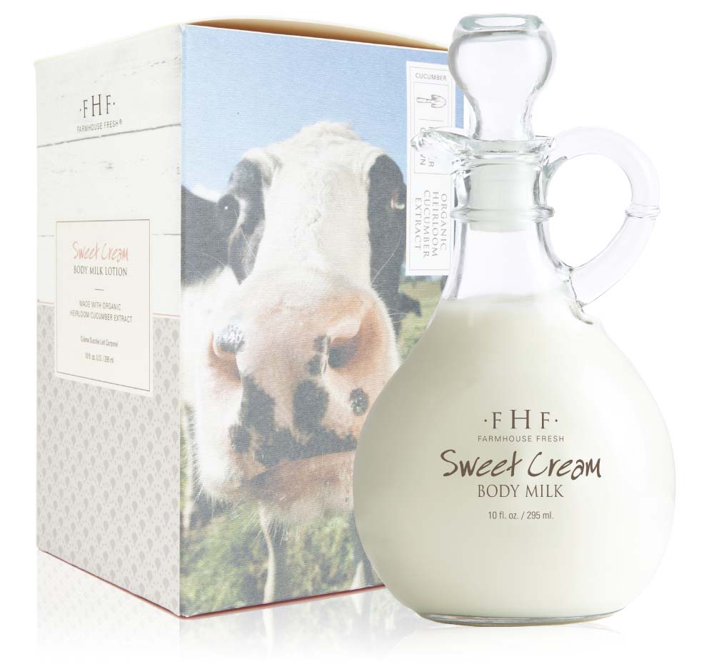 A cruet and a box of lightweight Sweet Cream Body Milk Lotion by FarmHouse Fresh that is infused with a blend of natural oils that provide lasting softness to skin.