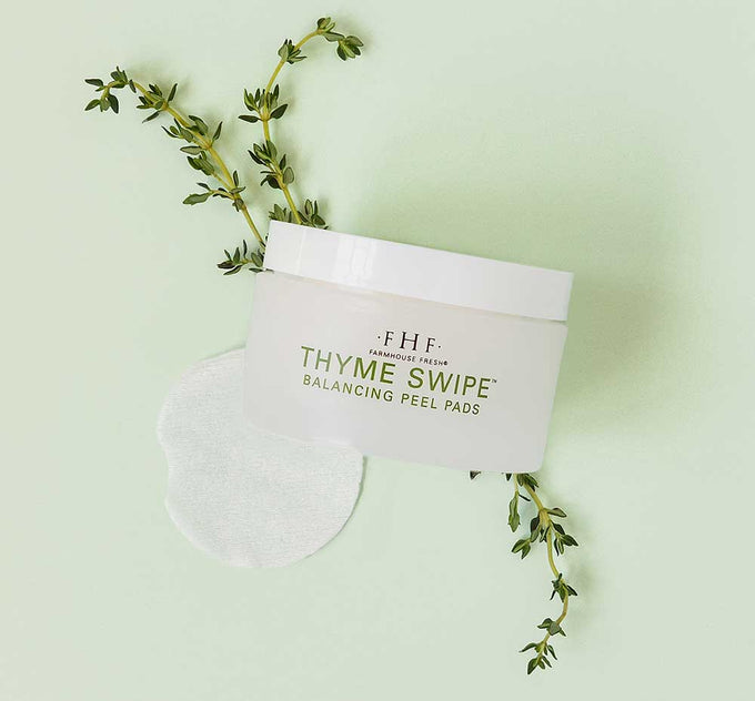 A jar of FarmHouse Fresh Thyme Swipe Balancing Peel Pads made with thyme and organic matcha.