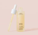 A bottle with pipette of FarmHouse Fresh Vitamin C Booster that brightens dull skin.