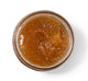 Top view of an open jar of Bourbon Bubbler Liquor Infused Body Polish made with brown sugar.