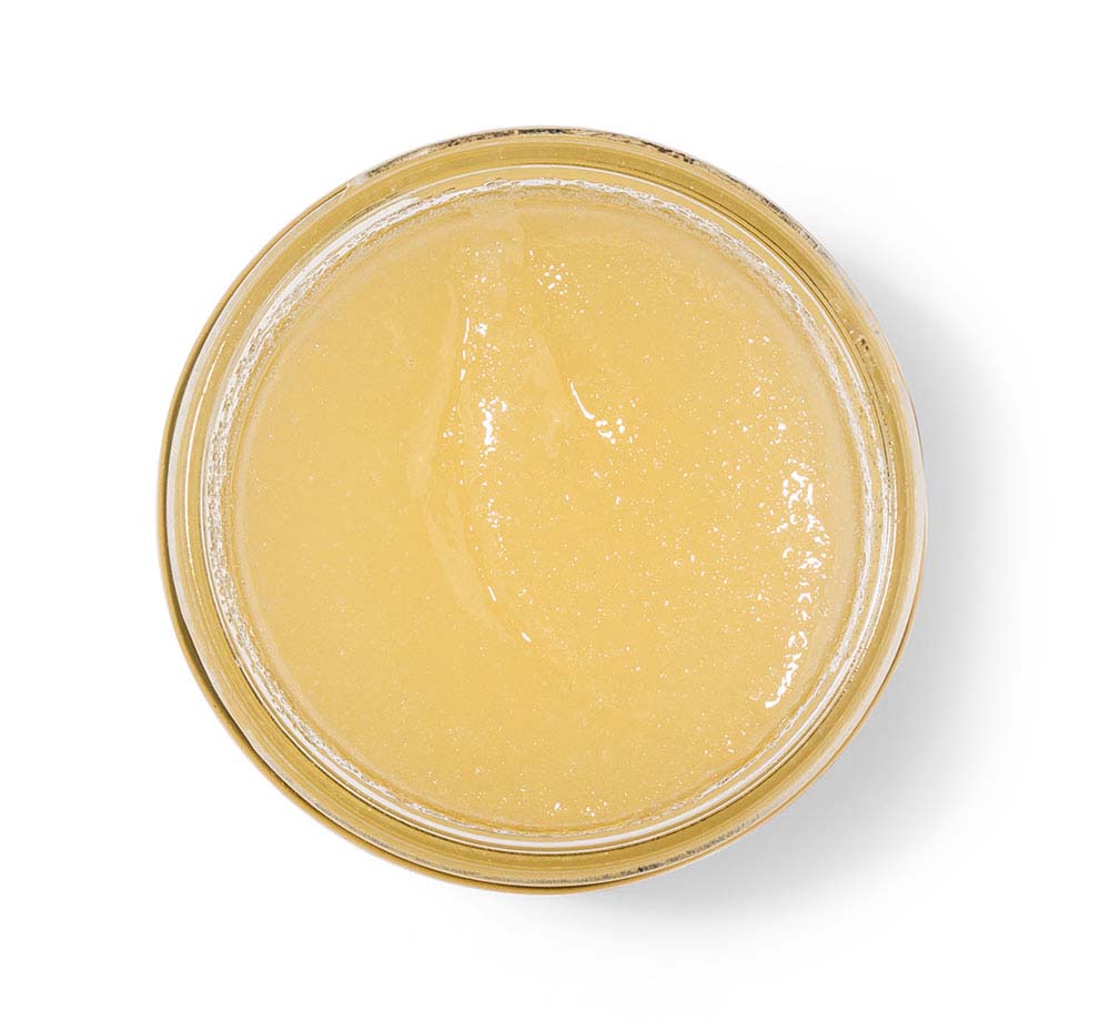 Top view of an opened jar of Brandy Pear Sea Salt Body Polish for dry skin.