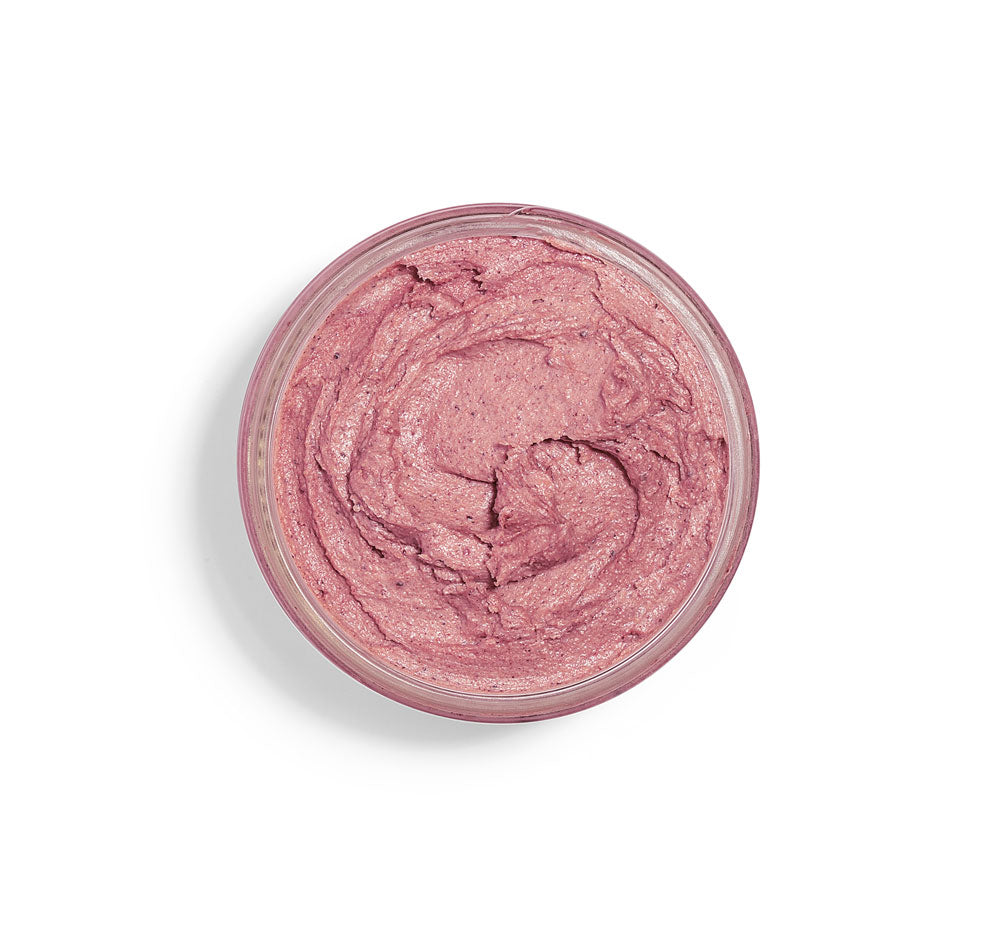 A top view of an opened jar of Illumination Fruit brightening face Mask by FarmHouse Fresh that contains natural fruit acids.