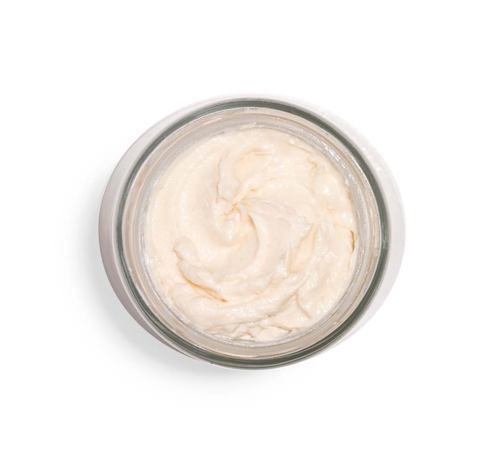 Top view of an opened jar of Mellow Moon body mousse by FarmHouse Fresh, made with CBD and age-fighting ingredients like peptides and retinol.